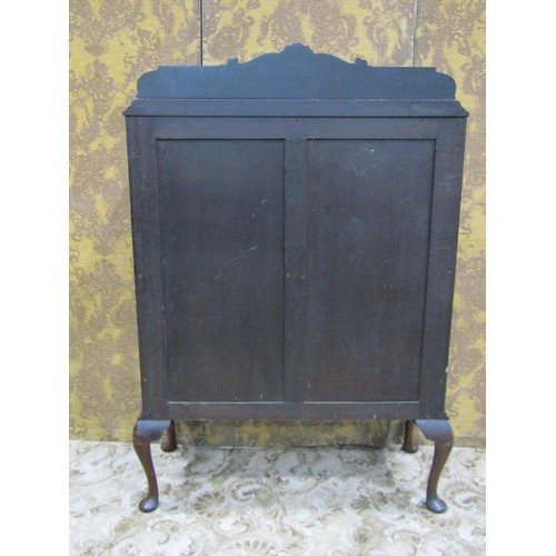 1264 - An Edwardian mahogany side cupboard with raised back rail over a pair of well matched flame veneered... 