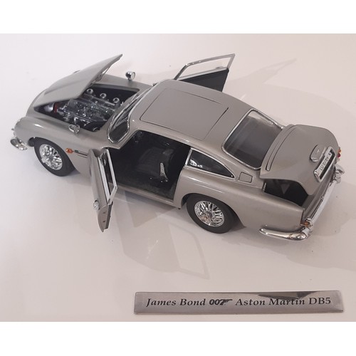 642 - James Bond Aston Martin DB5 Model by Danbury Mint in display case with hard wood base,  certificate ... 