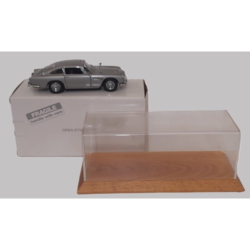 642 - James Bond Aston Martin DB5 Model by Danbury Mint in display case with hard wood base,  certificate ... 