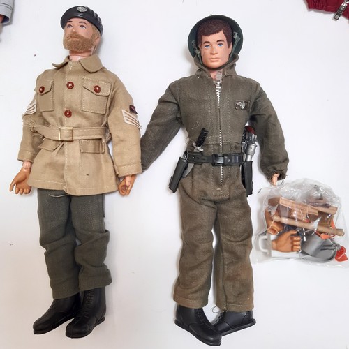 654 - A large collection of unsorted Action Man dolls, clothing, weapons, outdoor equipment etc including ... 