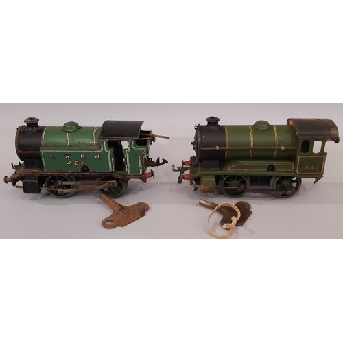 670 - A collection of 0 gauge railway models including clockwork locomotives 501 (boxed with tender) and t... 