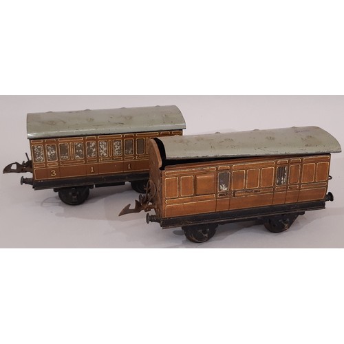 670 - A collection of 0 gauge railway models including clockwork locomotives 501 (boxed with tender) and t... 