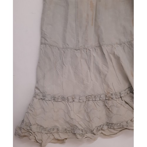 679 - Three late 19th /early 20th century garments comprising the following; a dress in ivory jacquard sil... 