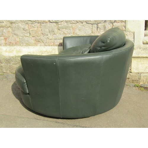 1272 - A substantial contemporary stitched green leather upholstered swivel lounge chair, 80cm high x 130cm... 