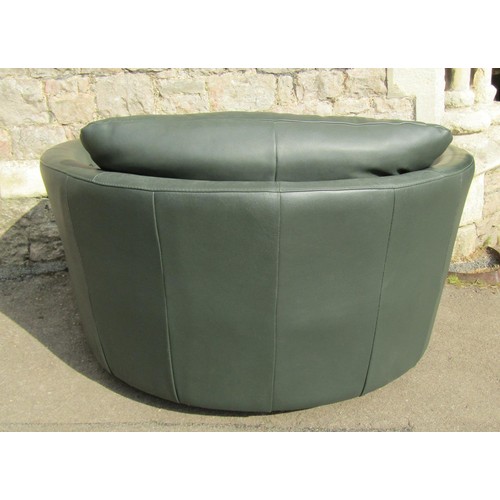 1272 - A substantial contemporary stitched green leather upholstered swivel lounge chair, 80cm high x 130cm... 