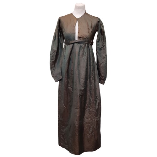 684 - Three garments comprising a 19th century empire style dress in green with a simple neckline, front h... 