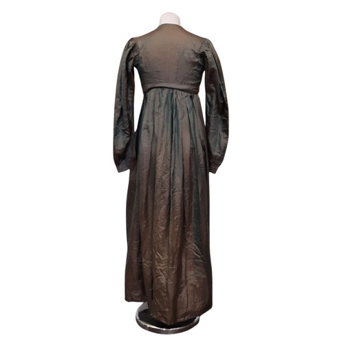 684 - Three garments comprising a 19th century empire style dress in green with a simple neckline, front h... 