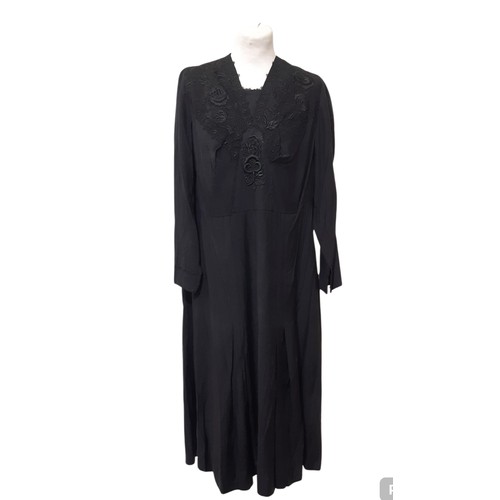 686 - 1920s dress in black slub weave silk, with a loose fit, kick pleats to skirt and lace detail around ... 