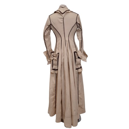 687 - Edwardian ladies dress in a dark cream cotton with contrasting brown piping and trim. Dress has fron... 