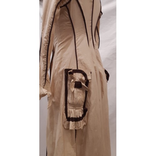 687 - Edwardian ladies dress in a dark cream cotton with contrasting brown piping and trim. Dress has fron... 