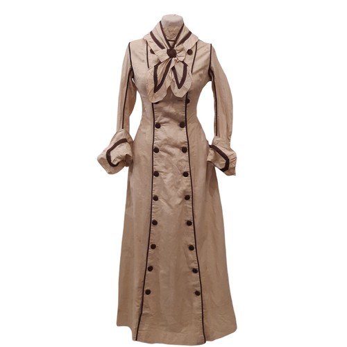 687 - Edwardian ladies dress in a dark cream cotton with contrasting brown piping and trim. Dress has fron... 