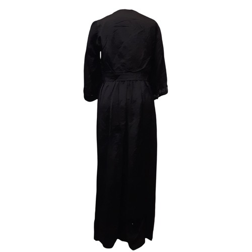 688 - Circa 1920 black silk dress with decorative  beaded detail to front panel and cuffs and lace trim at... 