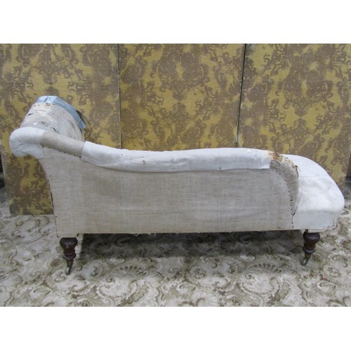 1277 - A Victorian chaise longue raised on turned supports with brass caps and castors stamped Copes & Coll... 