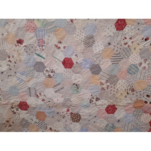 690 - Vintage hand stitched patchwork quilt of printed cotton hexagons lined with plain cotton 234 x 234 c... 