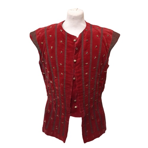 693 - A vintage velvet waistcoat embellished with goldwork embroidery and gold stars and lined with black ... 