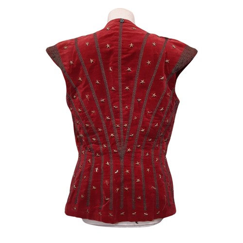 693 - A vintage velvet waistcoat embellished with goldwork embroidery and gold stars and lined with black ... 