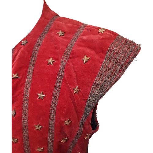 693 - A vintage velvet waistcoat embellished with goldwork embroidery and gold stars and lined with black ... 