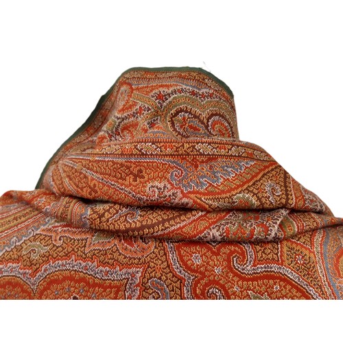 697 - A large paisley shawl with fringe 330 x 165cm