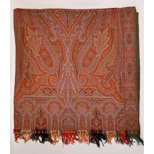 697 - A large paisley shawl with fringe 330 x 165cm