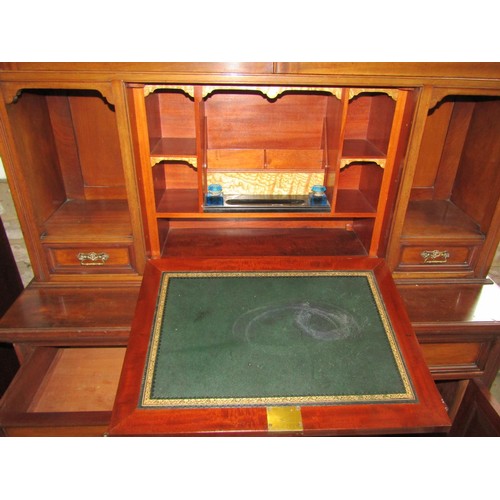 1281 - An unusual inlaid Edwardian secretaire bookcase enclosed by an arrangement of cupboards and drawers,... 