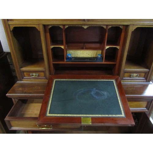 1281 - An unusual inlaid Edwardian secretaire bookcase enclosed by an arrangement of cupboards and drawers,... 