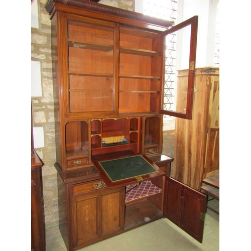 1281 - An unusual inlaid Edwardian secretaire bookcase enclosed by an arrangement of cupboards and drawers,... 