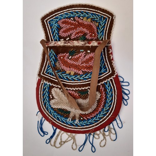 704 - A 19th century Native American beaded purse 17x16cm together with a leather lined beaded drawstring ... 