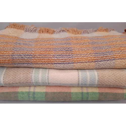 710 - Vintage quilts and blankets including a machine stitched quilt with contrasting panels of terracotta... 