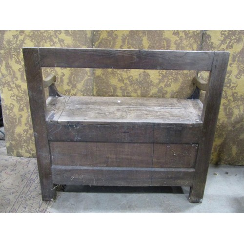 1294 - An antique oak box settle with simple rail back and down swept arms, 93cm high x 100cm x 42cm