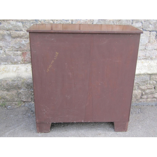 1297 - A reproduction mahogany bowfronted side cabinet with two frieze drawers over open shelves on bracket... 