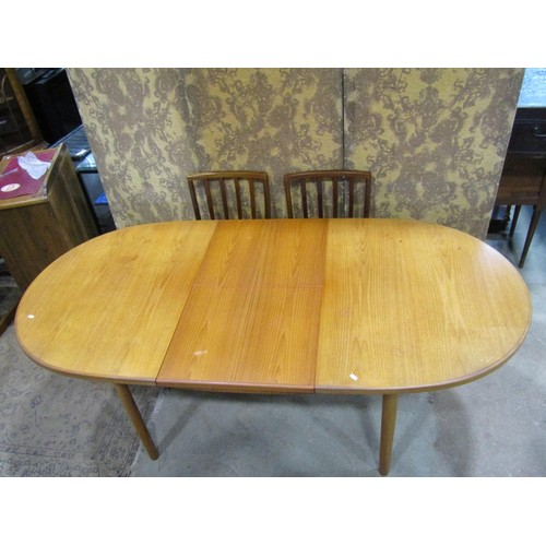 1298 - A Macintosh teak D end extending dining table with single bi-fold leaf, 76cm high x 206cm long (exte... 