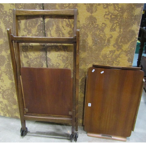 1302 - A mid 20th century walnut and stained beechwood two tier tea trolley with shaped tray top