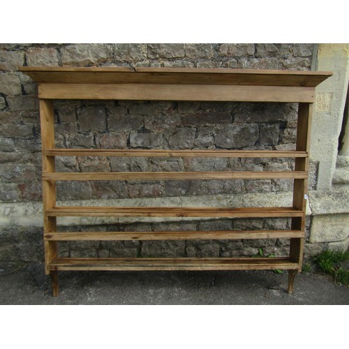 1324 - A rustic stripped pine wall mounted plate rack, probably Irish, 129cm high x 157cm wide