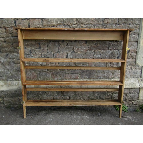 1324 - A rustic stripped pine wall mounted plate rack, probably Irish, 129cm high x 157cm wide