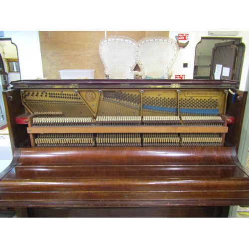 1325 - A C. Bechstein Berlin iron framed upright and over strung piano stamped 12505 and 7183F, together wi... 