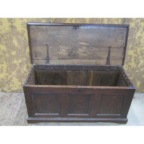 1329 - An antique oak coffer with hinged lid and panelled frame, 46cm high x 100cm x 43cm