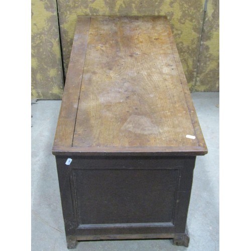 1329 - An antique oak coffer with hinged lid and panelled frame, 46cm high x 100cm x 43cm