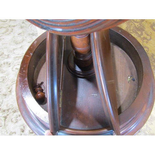 1239 - A Victorian mahogany shaving stand with adjustable circular bevelled edge mirror plate over a box co... 