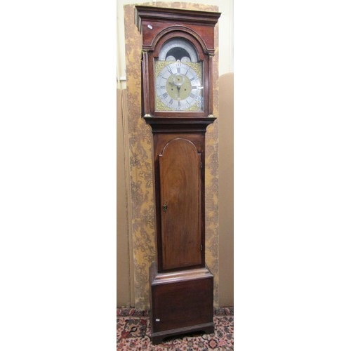 1344 - A Georgian mahogany longcase clock the hood enclosing a broken arch dial with silvered chapter ring,... 