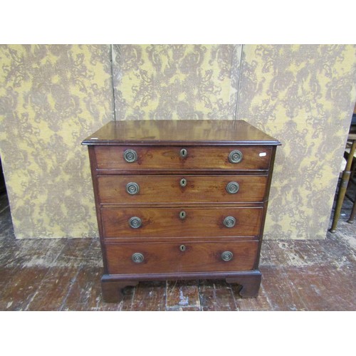 1347 - A small Georgian mahogany and oak lined chest of four drawers on bracket supports, 77cm wide