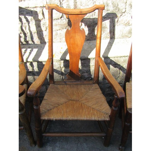 1351 - A Georgian oak countrymade elbow chair with box seat, further example in ash with vase shaped splat ... 