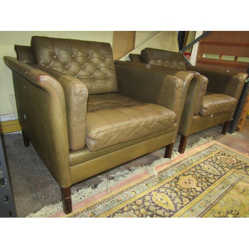 1352 - A pair of 20th century German green leather upholstered squared tub chairs in the Art Deco style, 70... 