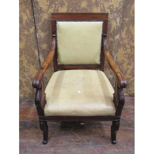 1354 - A late Regency mahogany library chair on sabre forelegs with hide upholstered seat and back