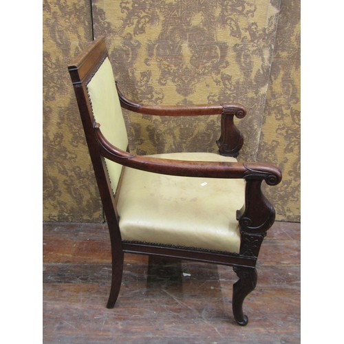 1354 - A late Regency mahogany library chair on sabre forelegs with hide upholstered seat and back