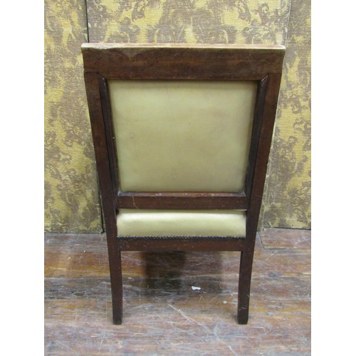 1354 - A late Regency mahogany library chair on sabre forelegs with hide upholstered seat and back