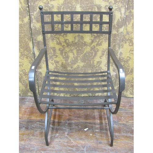 1359 - A contemporary steel X framed elbow chair