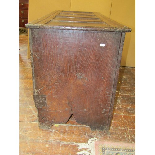 1362 - An 18th century oak plank coffer with panelled frame work and carved frieze, 71cm high x 137cm wide ... 