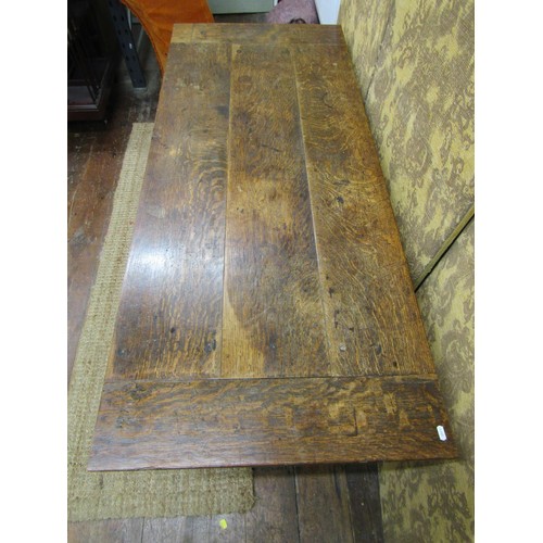 1365 - A small Georgian oak farmhouse table the plank top with cleated ends on square cut supports, 71cm hi... 