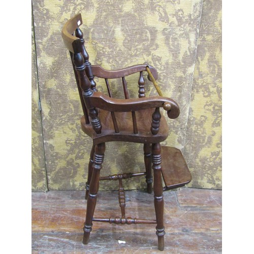 1366 - A 19th century mahogany child's high chair with stick back, turned supports, complete with step