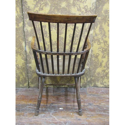 1368 - An early Georgian Windsor stick back chair in ash wood